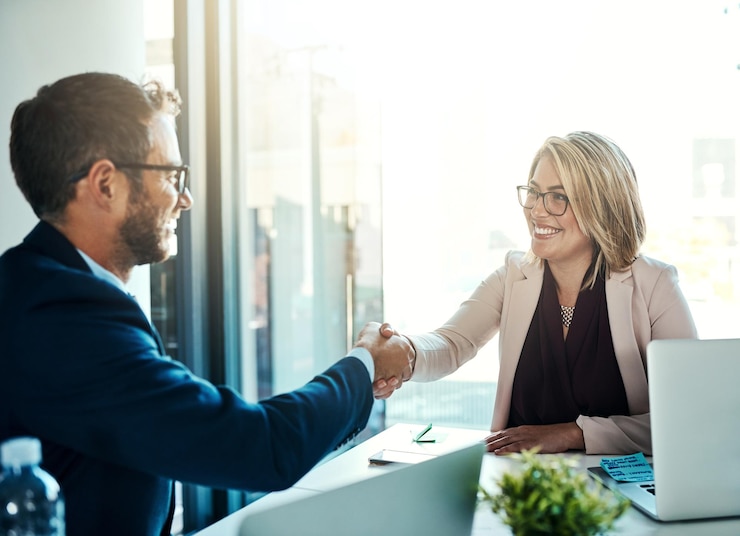 Two people preparing notes before a business meeting